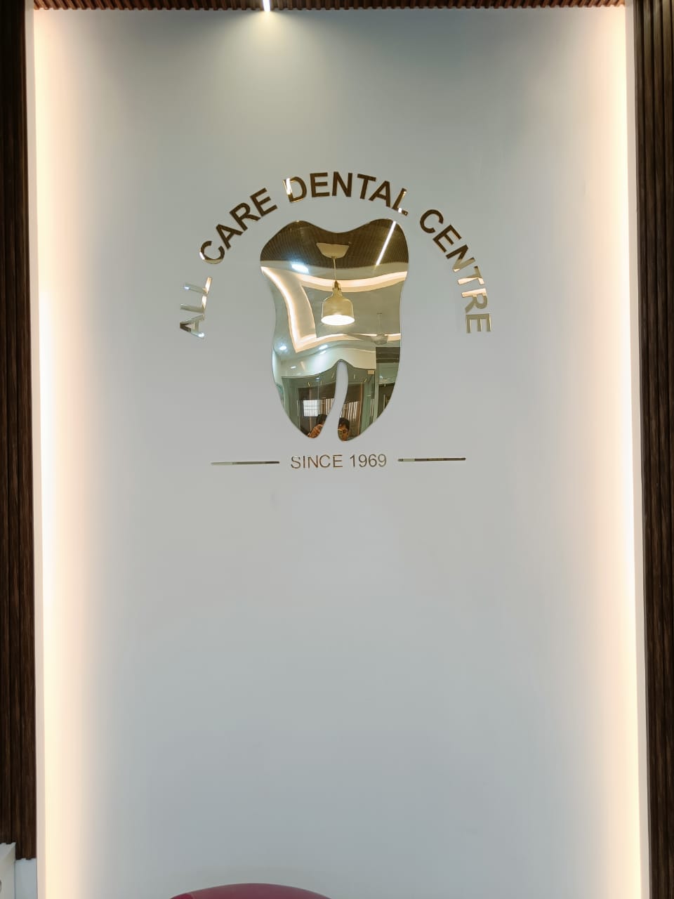The All Care name and emblem